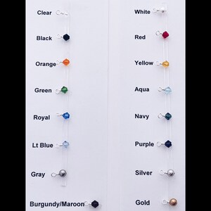 May include: A color chart with 10 different colored beads and their corresponding names. The colors include clear, black, orange, green, royal blue, light blue, gray, burgundy/maroon, white, red, yellow, aqua, navy, purple, silver, and gold.