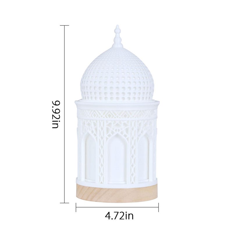 May include: White ceramic table lamp with a dome-shaped shade featuring intricate cutouts. The lamp is 9.92 inches tall and 4.72 inches wide.