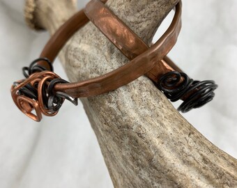 Choice of 2 copper steel bangles.