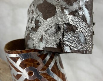 Choice of 2 leather longer cuffs.  Brown and grey both with silver in leather and aluminum .geometric and steampunk gears.