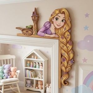 May include: A wooden door frame topper featuring a cartoon character with long blonde hair decorated with small flowers, a tall tower, a small frying pan, and a green lizard. The character wears a purple dress and rests on the frame corner.