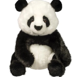 May include: A plush panda bear with black and white fur. The panda has black ears, eyes, and limbs, with a white face and belly. The stuffed animal is designed to sit upright.