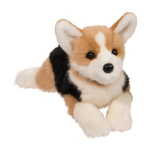 May include: A plush corgi dog toy in a lying position. The toy features a white chest, paws, and face markings, with tan and black fur accents. The dog has black eyes and a black nose.