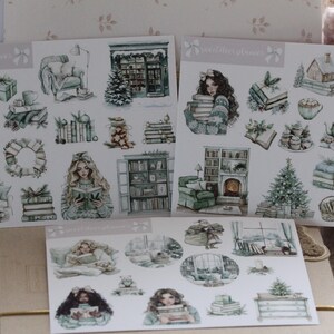 May include: Sheets of stickers featuring illustrations of women reading, books, Christmas trees, cozy interiors, and decorative elements in shades of green, white, and brown. The stickers have a watercolor style and are designed for planners.