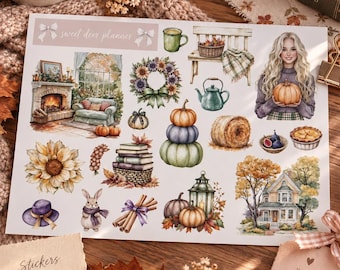 May include: A sticker sheet titled sweet deer planner featuring autumn-themed illustrations including a fireplace, a floral wreath, pumpkins, a teapot, a rabbit, cinnamon sticks, a house, and a person holding a pumpkin, with a cozy aesthetic.