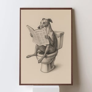May include: A framed pencil drawing shows a greyhound dog on a toilet, reading a newspaper. The artwork is set against a beige background, with the newspaper text visible. The frame is a dark brown colour.