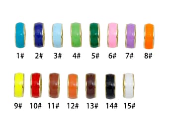 May include: A collection of fifteen small, cylindrical metal beads with colorful enamel coatings, each labeled with a number from 1# to 15#. The beads feature a gold-toned metal rim and come in various colors including blue, green, pink, purple, orange, yellow, red, brown, black, and white.