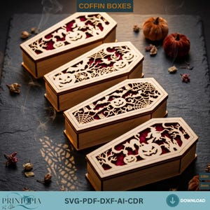 May include: Four light-colored wooden coffin boxes with intricate laser-cut lids featuring Halloween motifs like pumpkins, bats, and spiderwebs. The boxes have a deep red interior lining and are labeled with the text COFFIN BOXES and 1/8in.