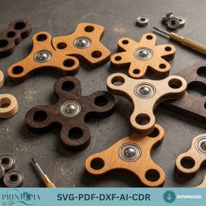 Peut inclure: Plusieurs toupies en bois de différentes formes et couleurs, allant du clair au foncé. Chaque toupie est équipée d'un roulement argenté au centre. L'image présente également de petits roulements métalliques et un tournevis. Le texte "SVG-PDF-DXF-AI-CDR" est visible.