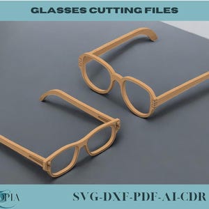 Könnte beinhalten: Zwei Brillen aus Holz. Die Brillen sind braun und haben ein schlichtes Design. Das Bild enthält den Text "SVG-DXF-PDF-AI-CDR".