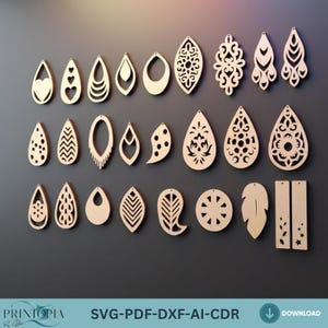 May include: A collection of laser-cut wooden earrings in various shapes and designs, including teardrops, ovals, and leaves. Some earrings feature intricate patterns, while others have simple cutouts. The earrings are displayed against a dark gray background.
