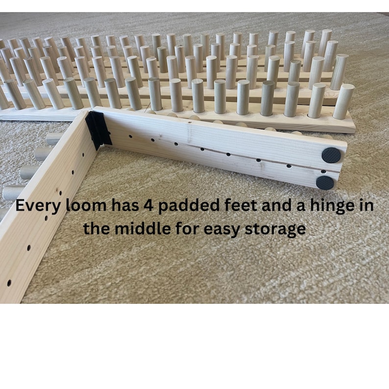 May include: Wooden weaving loom with numerous pegs, featuring a hinged design for compact storage. The text reads: "Every loom has 4 padded feet and a hinge in the middle for easy storage."