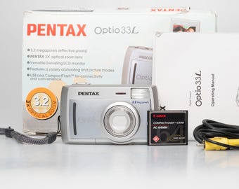 Pentax Optio 33L 3.2 megapixel digicam w/ 64MB card + cables + box + manuals (serial 6463008)