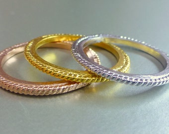 Gold stacking rings. 14k gold.  textured bands.