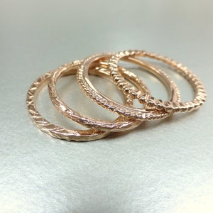 14k gold stacking ring set. Also available individually. Rose gold wedding bands. 14k pink gold textured bands. image 1