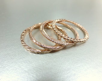 14k gold stacking ring set. Also available individually. Rose gold wedding bands. 14k pink gold textured bands.