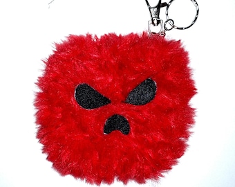 Red keychain, bag accessory.