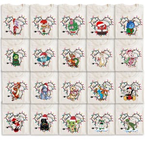 May include: A collection of off-white t-shirts featuring various cartoon characters in Christmas-themed designs. Each shirt has a Mickey Mouse head outline made of Christmas lights, the year 2026, and space for a name.