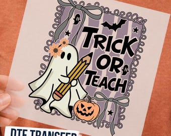May include: A DTF transfer sheet featuring a white ghost wearing orange flowers, holding a yellow pencil, and standing next to an orange jack-o'-lantern. The design includes the text TRICK OR TEACH, black bats, stars, and grey bows on a purple striped background.