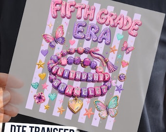 May include: A DTF transfer sheet featuring the text FIFTH GRADE ERA in pink and purple bubble letters. The design includes two beaded bracelets with the words FRIENDSHIP BRACELET, surrounded by butterflies, hearts, stars, and gems.