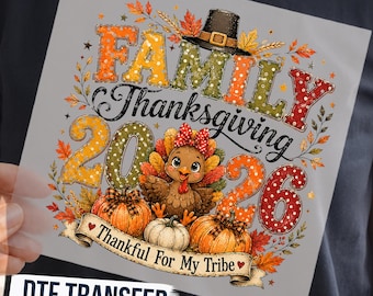 May include: A graphic design featuring the text FAMILY THANKSGIVING 2026 and Thankful For My Tribe. The design includes a cartoon turkey wearing a red polka dot bow, two pumpkins, autumn leaves, and a pilgrim hat, all in orange, red, and green.