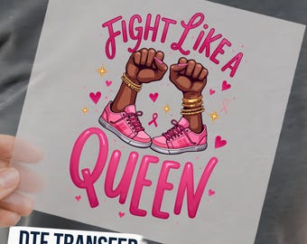 May include: A DTF transfer sheet featuring the text FIGHT LIKE A QUEEN in pink. The design includes two dark-skinned fists raised in the air, wearing gold bracelets and pink sneakers, surrounded by small pink hearts, stars, and breast cancer ribbons.
