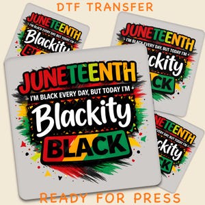 May include: A square DTF transfer sheet featuring the text JUNETEENTH, I'M BLACK EVERY DAY, BUT TODAY I'M Blackity BLACK in red, yellow, green, and black colors. The design includes brushstroke accents and splatter patterns on a light gray background.