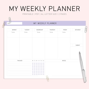 以下が含まれることがあります： 上部に「MY WEEKLY PLANNER」の文字が入った白い週間プランナー。プランナーには、週の各曜日、トラッカー、メモのセクションが含まれています。シルバーのペンとペーパークリップが含まれています。
