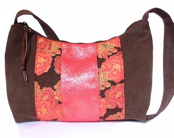 brown and pink hobo bag with pink suede accents