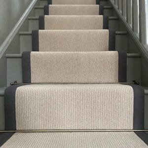 Beige stair runner with black whipped edge