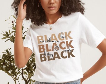 May include: White t-shirt with the words "BLACK" stacked on top of each other in different shades of brown. Each word has a different word in smaller font underneath it, reading "love", "excellence", "joy", "pride", and "history".