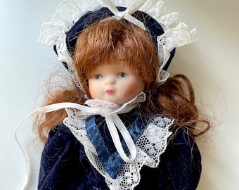 Vintage porcelain doll - red hair, royal blue velvet dress