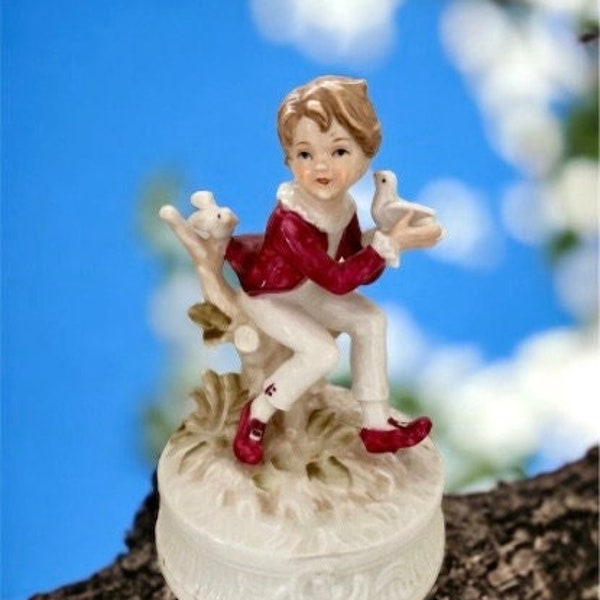 1977 Berman and Anderson stunning porcelain music box - boy dressed in red and white feeding birds