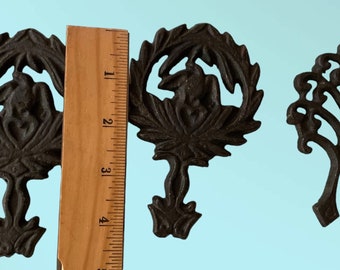 Set of 4 small cast iron trivets - vintage or antique?