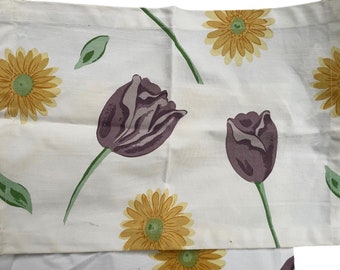 Pair of vintage placemats - with yellow daisies and purple tulips - made of a heavy fabric canvas material