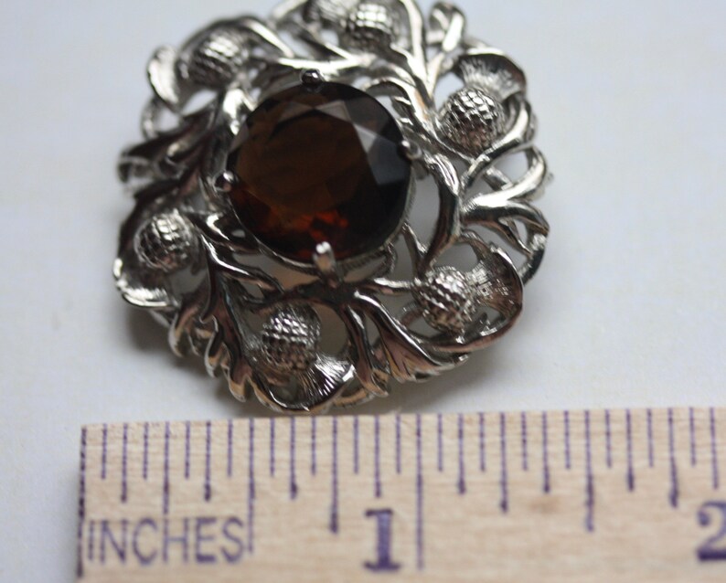 Stunning vintage pin with faceted center