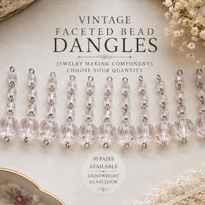 May include: Twelve clear faceted bead dangles arranged in a row, each featuring a large bottom bead and two smaller beads connected by silver-toned metal links. Text on the image reads: VINTAGE FACETED BEAD DANGLES, JEWELRY MAKING COMPONENTS, CHOOSE YOUR QUANTITY, 10 PAIRS AVAILABLE, LIGHTWEIGHT GLASS LOOK.