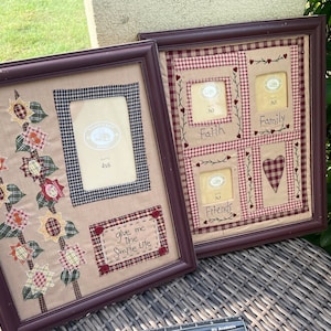 May include: Two brown picture frames with a beige background. The frame on the left has a patchwork design with sunflowers and a bird. The frame on the right has a red and white checkered design with four smaller frames. The smaller frames have the words "Faith", "Family", "Friends", and a heart.