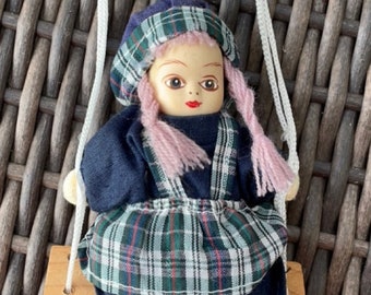 Little porcelain girl doll on swing dangling figurine by Lidco