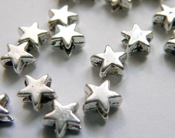 20 itty bitty teenie wennie silver spacer stars