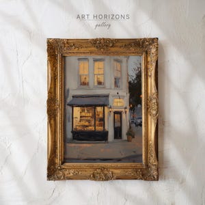 May include: An oil painting in a gold ornate frame depicting a bakery shop. The shop features a black awning and a display window filled with baked goods. The painting is signed "ART HORIZONS gallery". The building has three windows with warm interior lighting.