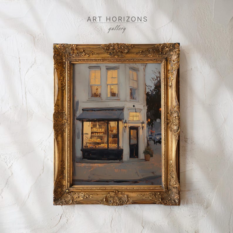 May include: An oil painting in a gold ornate frame depicting a bakery shop. The shop features a black awning and a display window filled with baked goods. The painting is signed "ART HORIZONS gallery". The building has three windows with warm interior lighting.