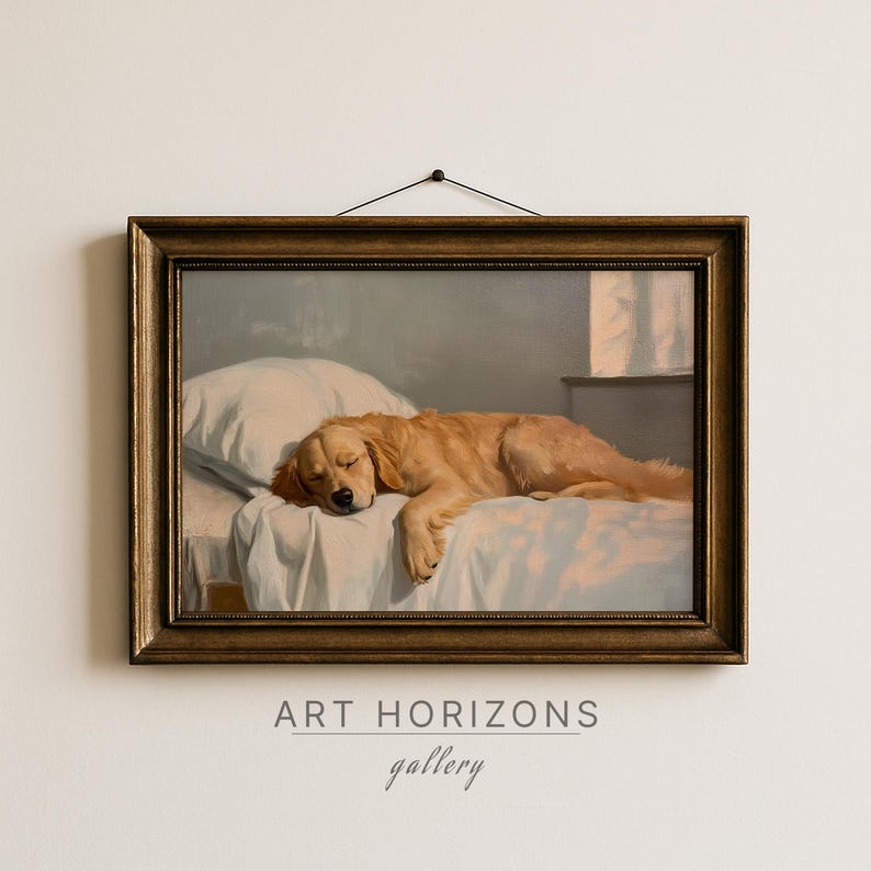 May include: A framed painting depicts a sleeping golden retriever dog on a bed with a white pillow and sheet. The artwork has a warm color palette and is set in a room with a window. The frame is a dark gold color. The text "ART HORIZONS gallery" is at the bottom.