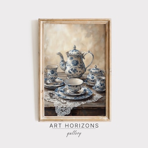 Puede incluir: Una pintura enmarcada de un juego de té de porcelana azul y blanco sobre una mesa con un mantel de encaje. El juego de té incluye una tetera, una jarra de crema, un azucarero y dos tazas y platillos.