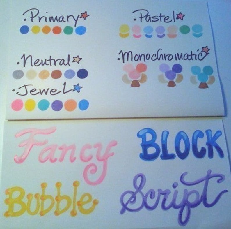 May include: A white sheet of paper with color swatches labeled "Primary", "Pastel", "Neutral", "Jewel", "Monochromatic", "Fancy", "Block", "Bubble", and "Script".