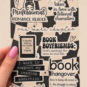 May include: A rectangular sticker sheet with a black and beige checkered background featuring various book-themed text designs including Professional Romance Reader, Book Boyfriends, I work to support my reading addiction, and book hangover.