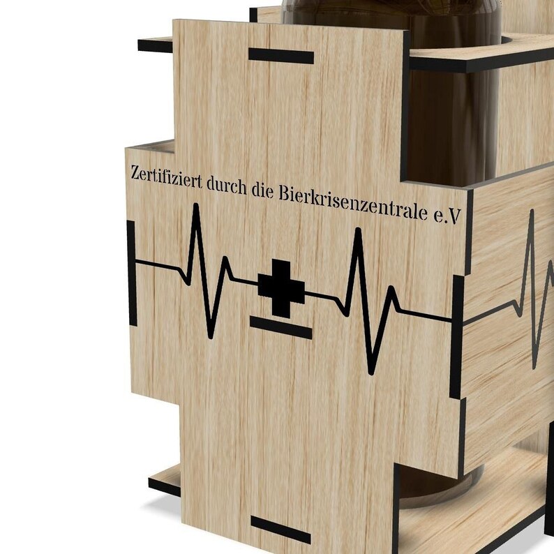 a wooden object with a heart-shaped symbol and text on it.
