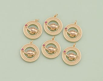 May include: Six gold-toned metal charms in the shape of a circle with a genie lamp design. Each charm has a pink gemstone in the centre of the lamp.
