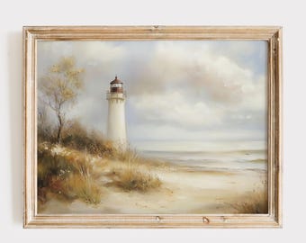 May include: A framed painting of a white lighthouse on a sandy beach with a cloudy sky. The lighthouse has a red roof and is surrounded by tall grasses.