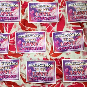 May include: Rectangular stickers with the text "TAX EVASION IS MY LOVE LANGUAGE" in a pink and purple design. The stickers are arranged on a red and white patterned fabric.